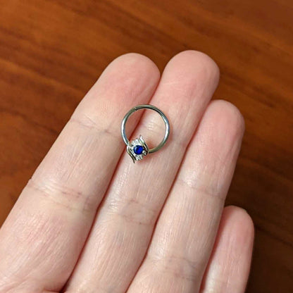 16G 3/8 Clear Blue Gem Oval Swirl Hinged Segment Ring
