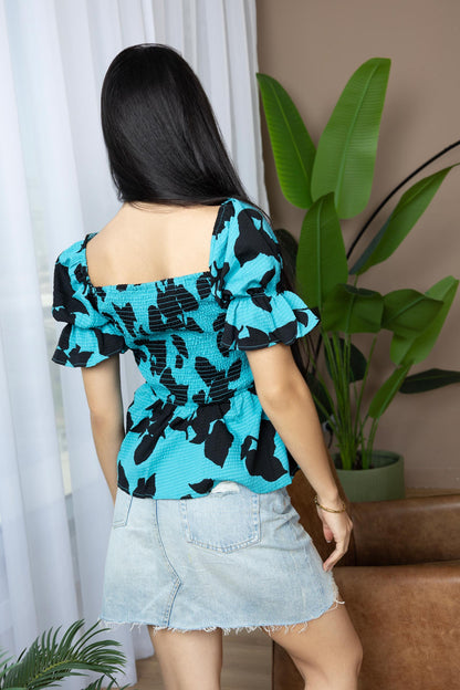 Bailey in Bold Peplum Top In Blue And Black